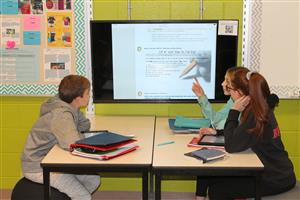Students Collaborating in 7th grade with apple TV 